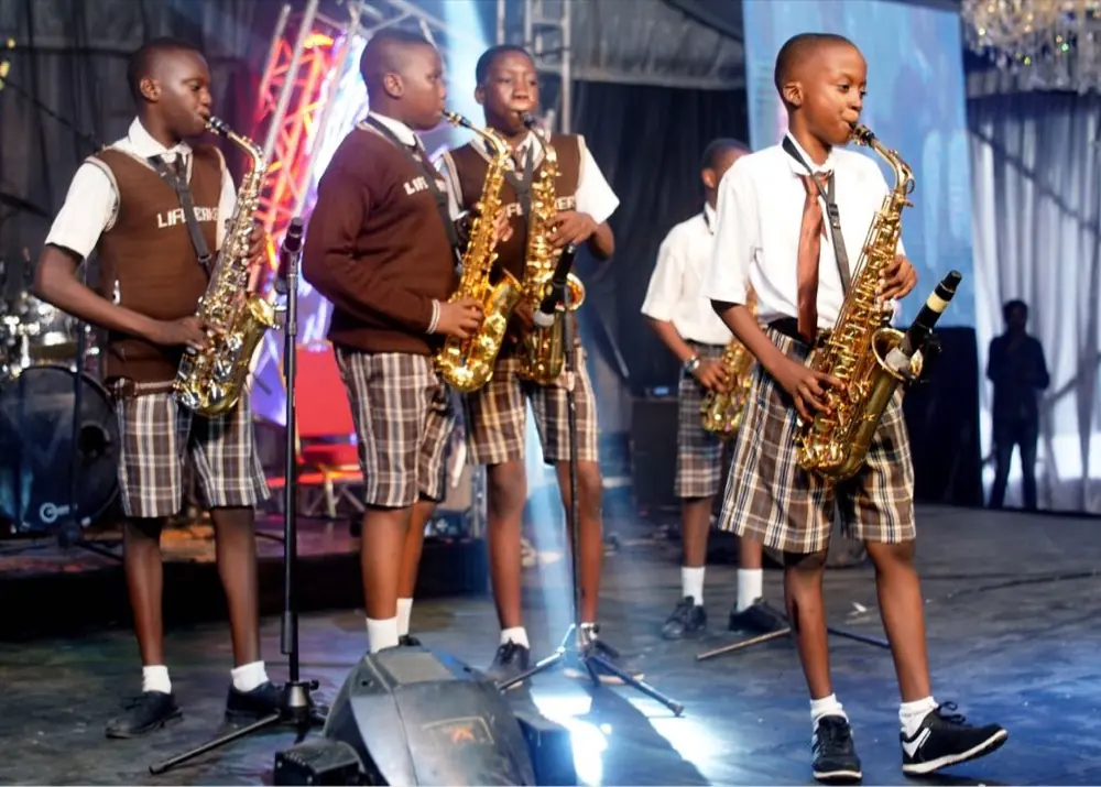 Life Baker students performing on stage with saxophones
