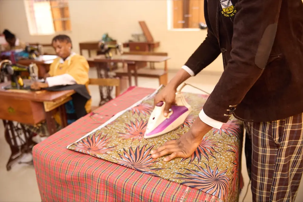 Pressing finished garments in the fashion workshop
