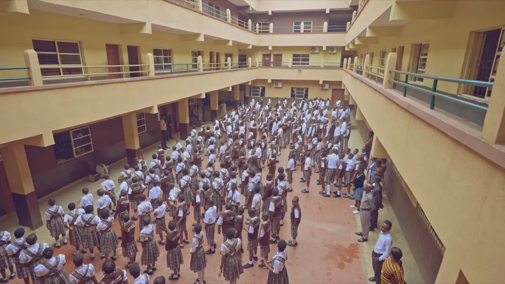 The whole school gathered for assembly in the central courtyard, seen from an upper floor