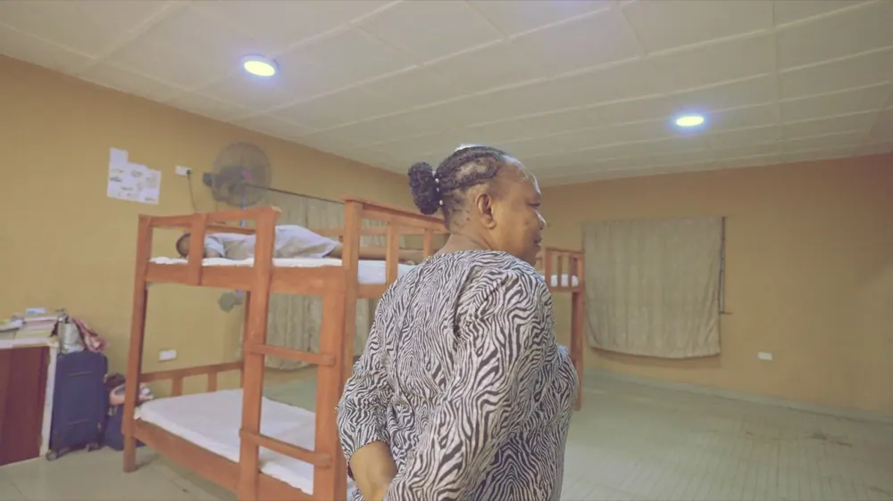 A member of the boarding staff checking a dormitory