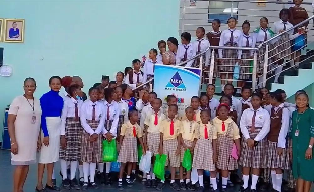 Primary pupils lined up with their prize bags at a school ceremony